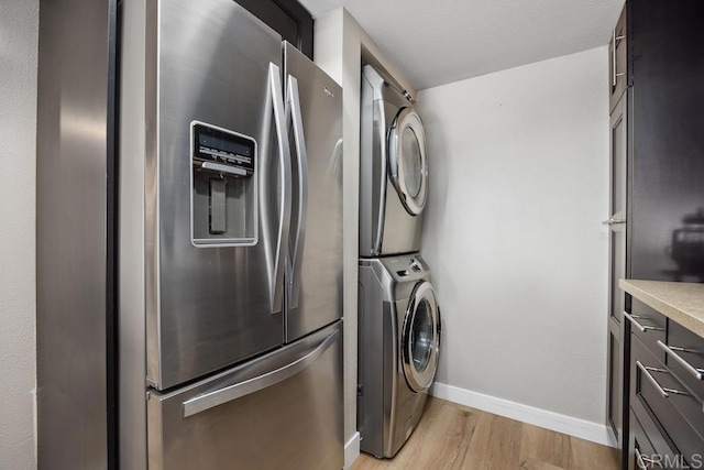 183 Mangano Cir, Encinitas, CA 92024 - washroom with stacked washer / drying machine and light wood finished floors