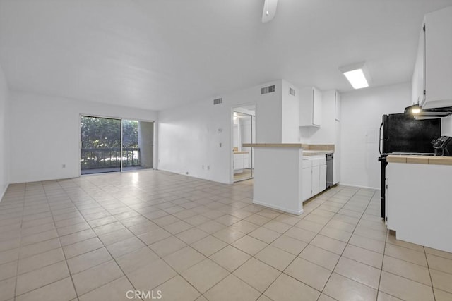 23515 Lyons Ave Unit 140, Valencia, CA 91355 - kitchen featuring open floor plan, white cabinetry, stainless steel dishwasher, and light tile patterned flooring