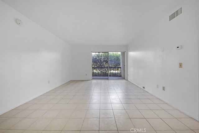 23515 Lyons Ave Unit 140, Valencia, CA 91355 - empty room featuring light tile patterned flooring and a smoke detector
