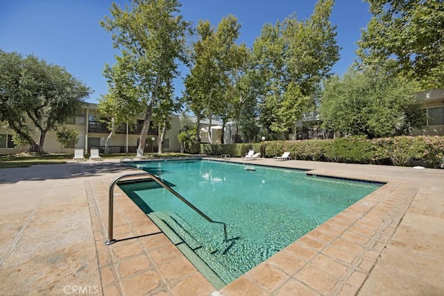 23515 Lyons Ave Unit 140, Valencia, CA 91355 - community pool with a patio area