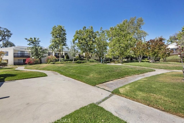 23515 Lyons Ave Unit 140, Valencia, CA 91355 - view of community featuring a yard