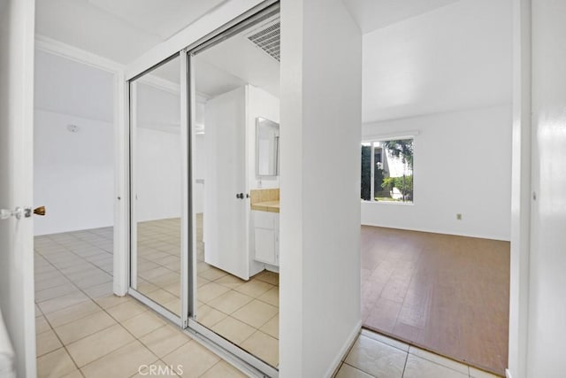 23515 Lyons Ave Unit 140, Valencia, CA 91355 - hall with light tile patterned floors