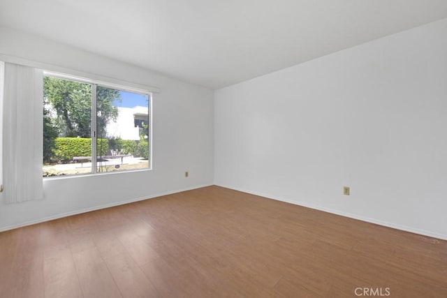 23515 Lyons Ave Unit 140, Valencia, CA 91355 - unfurnished room with wood finished floors and baseboards