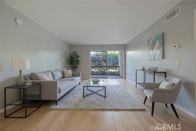 23515 Lyons Ave Unit 140, Valencia, CA 91355 - living room featuring wood finished floors and baseboards