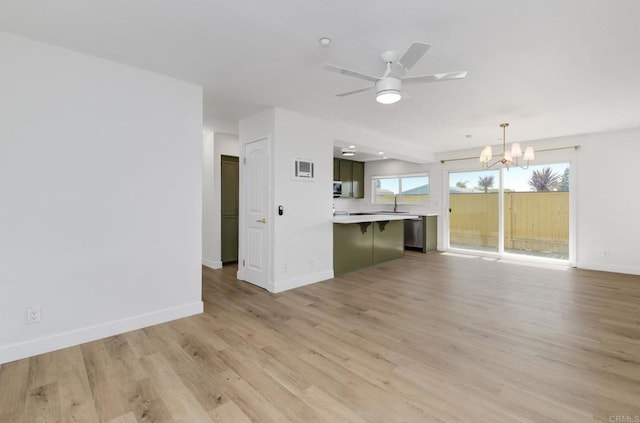 615 Fredricks Ave Unit 157, Oceanside, CA 92058 - unfurnished living room with a chandelier, light wood-type flooring, and ceiling fan