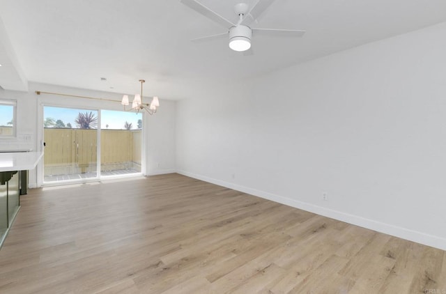 615 Fredricks Ave Unit 157, Oceanside, CA 92058 - unfurnished dining area featuring a chandelier, light wood finished floors, and ceiling fan
