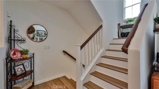 28653 Bar Hbr, Temecula, CA 92591 - staircase featuring wood finished floors and vaulted ceiling
