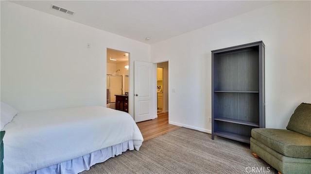 28653 Bar Hbr, Temecula, CA 92591 - bedroom featuring light wood finished floors and ensuite bath