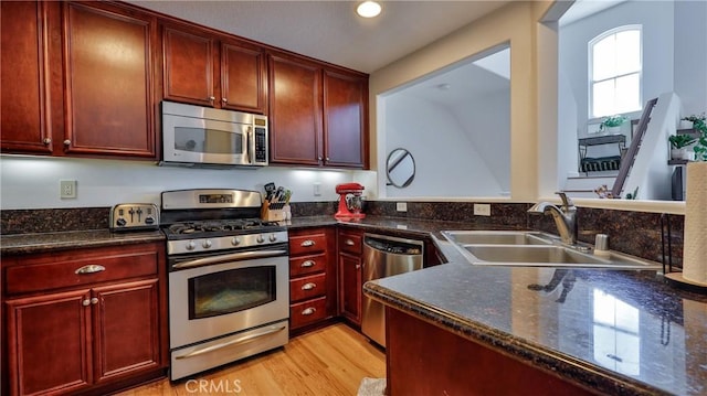 28653 Bar Hbr, Temecula, CA 92591 - kitchen with stainless steel appliances, dark brown cabinets, light wood-type flooring, and recessed lighting