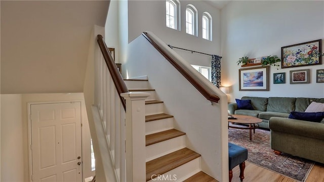 28653 Bar Hbr, Temecula, CA 92591 - stairway featuring a towering ceiling and wood finished floors