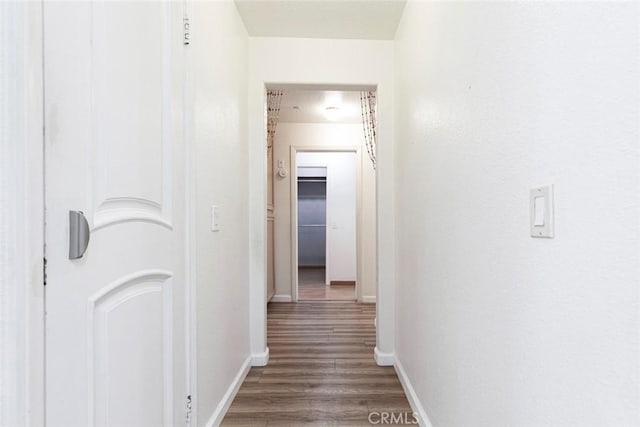 16940 Chatsworth St Unit 208, Granada Hills, CA 91344 - hallway featuring wood finished floors and baseboards