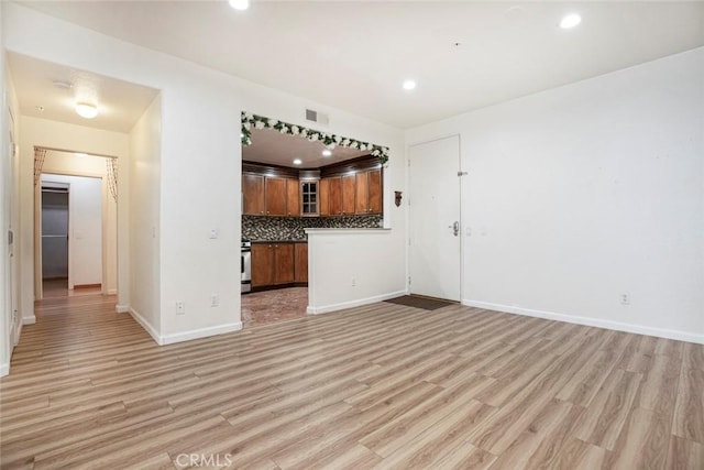 16940 Chatsworth St Unit 208, Granada Hills, CA 91344 - unfurnished living room with light wood-type flooring and recessed lighting