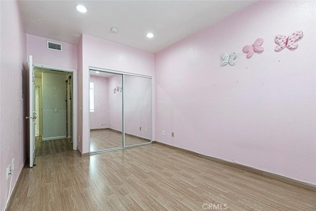 16940 Chatsworth St Unit 208, Granada Hills, CA 91344 - unfurnished bedroom with light wood-type flooring, a closet, and recessed lighting