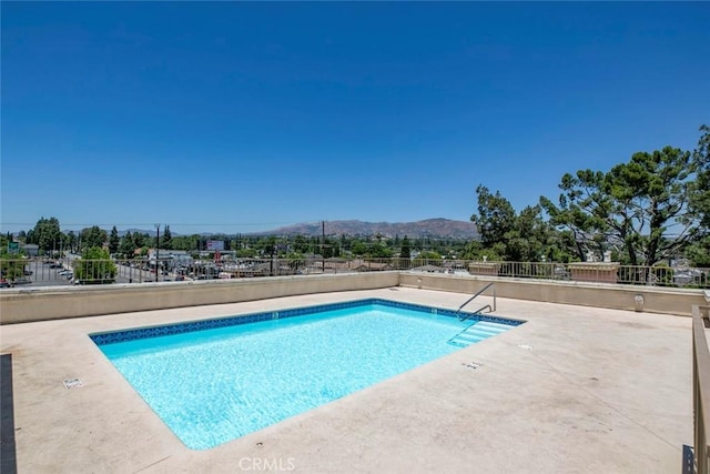 16940 Chatsworth St Unit 208, Granada Hills, CA 91344 - community pool with a mountain view and a patio area