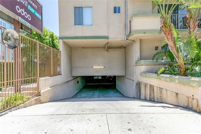 16940 Chatsworth St Unit 208, Granada Hills, CA 91344 - view of exterior entry with driveway and stucco siding