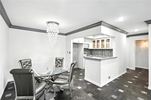 12720 Burbank Blvd Unit 121, Valley Village, CA 91607 - dining area featuring a chandelier and crown molding