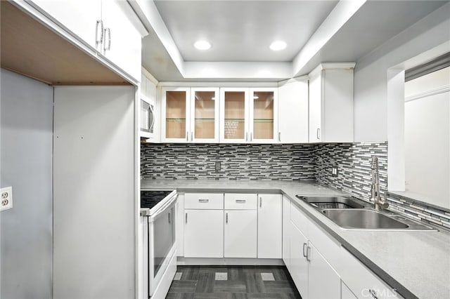 12720 Burbank Blvd Unit 121, Valley Village, CA 91607 - kitchen with white electric range oven, stainless steel microwave, white cabinets, tasteful backsplash, and recessed lighting