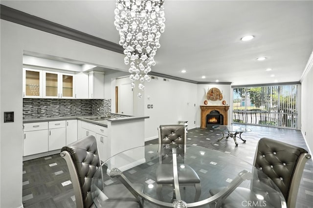 12720 Burbank Blvd Unit 121, Valley Village, CA 91607 - dining area featuring ornamental molding, a lit fireplace, and recessed lighting