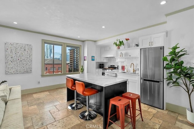 315 W 3rd St Unit 301, Long Beach, CA 90802 - kitchen featuring stainless steel appliances, stone tile floors, recessed lighting, open shelves, and white cabinets
