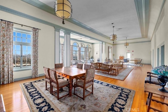 315 W 3rd St Unit 301, Long Beach, CA 90802 - dining space featuring plenty of natural light, wood finished floors, ornamental molding, and a raised ceiling