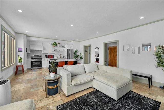 315 W 3rd St Unit 301, Long Beach, CA 90802 - living room featuring stone tile flooring, recessed lighting, and crown molding
