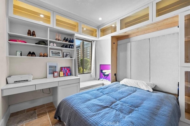315 W 3rd St Unit 301, Long Beach, CA 90802 - bedroom featuring stone tile flooring, built in desk, and recessed lighting