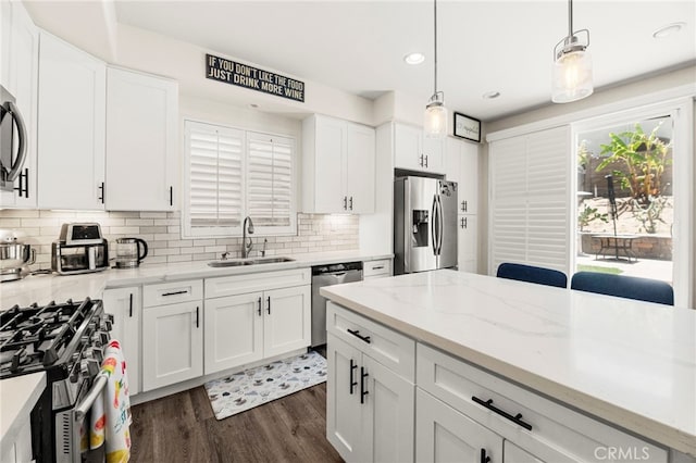 11209 Pinecone St, Corona, CA 92883 - kitchen with appliances with stainless steel finishes, dark wood-type flooring, white cabinetry, backsplash, and recessed lighting