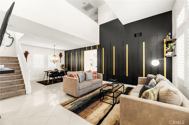 11209 Pinecone St, Corona, CA 92883 - living area featuring an accent wall, stairs, tile patterned flooring, and a towering ceiling