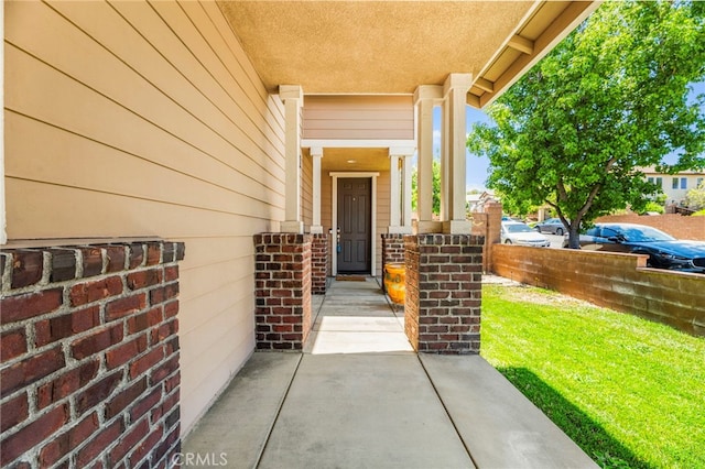 11209 Pinecone St, Corona, CA 92883 - view of exterior entry with a porch and brick siding