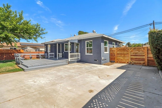 8450 Dallas St, La Mesa, CA 91942 - back of property with a patio area, a wooden deck, and stucco siding