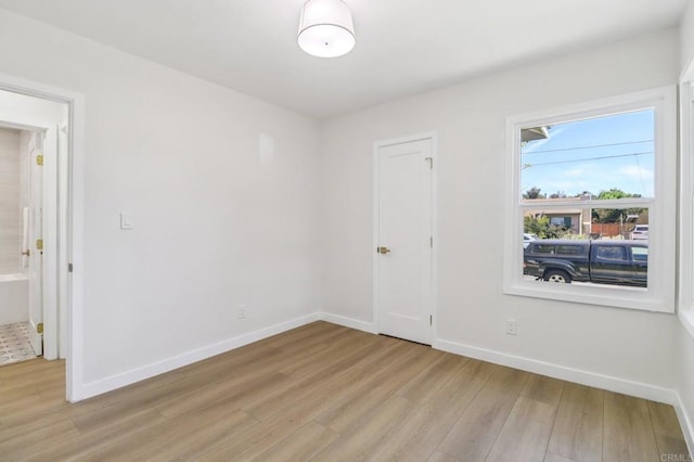 8450 Dallas St, La Mesa, CA 91942 - empty room with light wood-style floors and baseboards