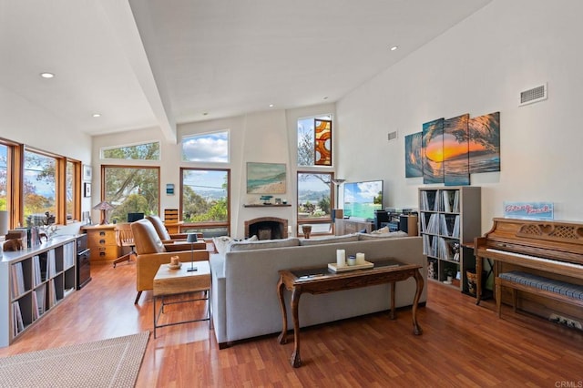 764 E Solana Cir, Solana Beach, CA 92075 - living area featuring wood finished floors, a fireplace, a high ceiling, and recessed lighting