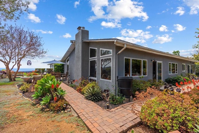 764 E Solana Cir, Solana Beach, CA 92075 - view of side of property featuring a chimney, stucco siding, and a patio area