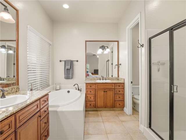 425 W Trenton Ave, Clovis, CA 93619 - bathroom featuring two vanities, a shower stall, a garden tub, and tile patterned floors