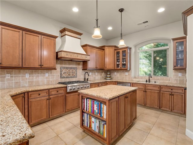 425 W Trenton Ave, Clovis, CA 93619 - kitchen featuring custom range hood, brown cabinetry, stainless steel appliances, decorative backsplash, and pendant lighting