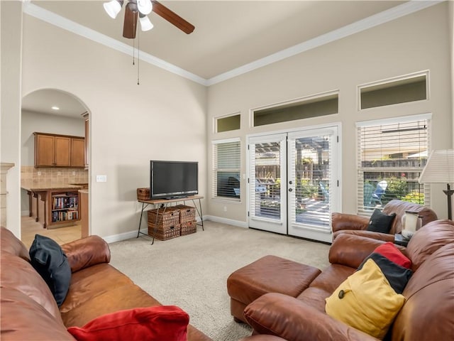 425 W Trenton Ave, Clovis, CA 93619 - living area featuring a towering ceiling, ceiling fan, arched walkways, light carpet, and crown molding