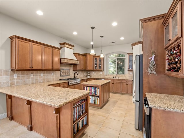 425 W Trenton Ave, Clovis, CA 93619 - kitchen with premium range hood, appliances with stainless steel finishes, open shelves, a peninsula, and brown cabinetry