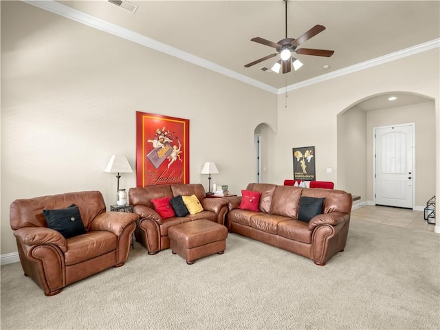 425 W Trenton Ave, Clovis, CA 93619 - living room featuring arched walkways, light carpet, ceiling fan, and ornamental molding