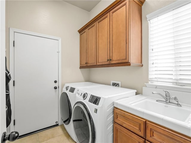 425 W Trenton Ave, Clovis, CA 93619 - washroom featuring separate washer and dryer, cabinet space, plenty of natural light, and light tile patterned flooring