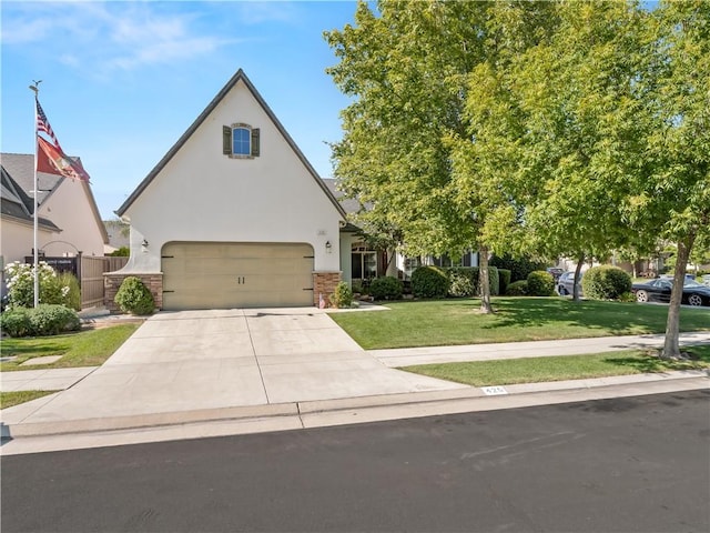 425 W Trenton Ave, Clovis, CA 93619 - view of front of property featuring stucco siding, a front lawn, concrete driveway, a garage, and brick siding