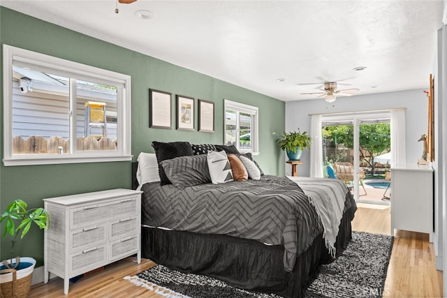 571 Redwood Way, Chico, CA 95926 - bedroom featuring access to exterior, wood finished floors, and a ceiling fan