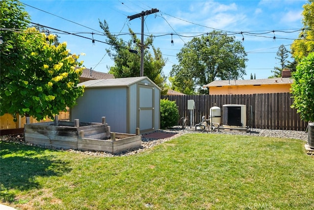 571 Redwood Way, Chico, CA 95926 - fenced backyard with a storage unit and a garden