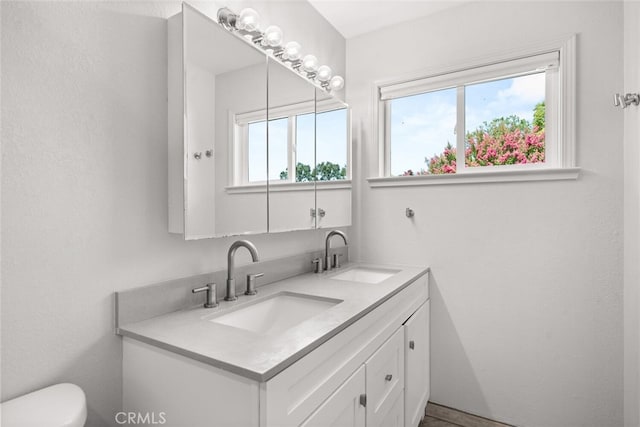 571 Redwood Way, Chico, CA 95926 - bathroom with double vanity and toilet
