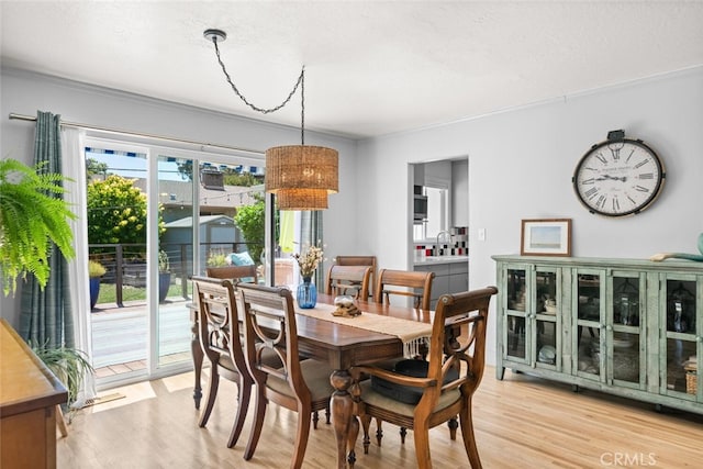 571 Redwood Way, Chico, CA 95926 - dining room with light wood-type flooring and ornamental molding