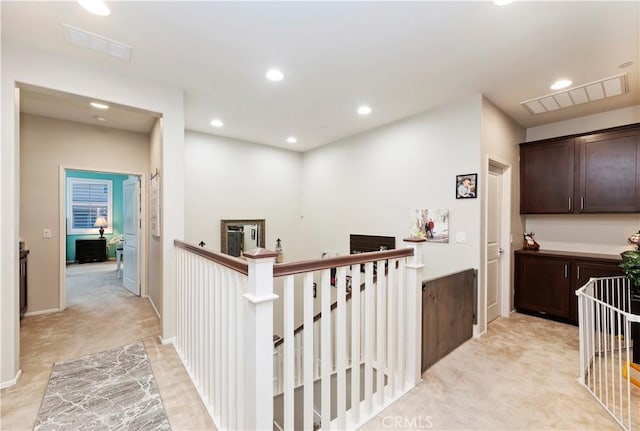 9574 Alta Cresta Ave, Riverside, CA 92508 - hall featuring an upstairs landing, light colored carpet, and recessed lighting