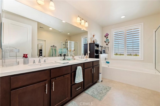9574 Alta Cresta Ave, Riverside, CA 92508 - full bath with a shower stall, plenty of natural light, double vanity, a garden tub, and recessed lighting
