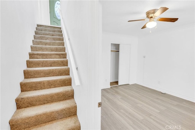 26188 Boulder Ln, Twin Peaks, CA 92391 - stairway with ornamental molding, ceiling fan, and wood finished floors