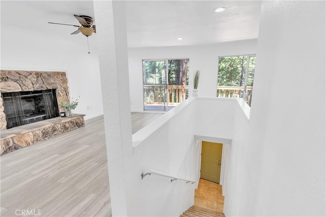 26188 Boulder Ln, Twin Peaks, CA 92391 - stairway with a ceiling fan, recessed lighting, wood finished floors, and a fireplace