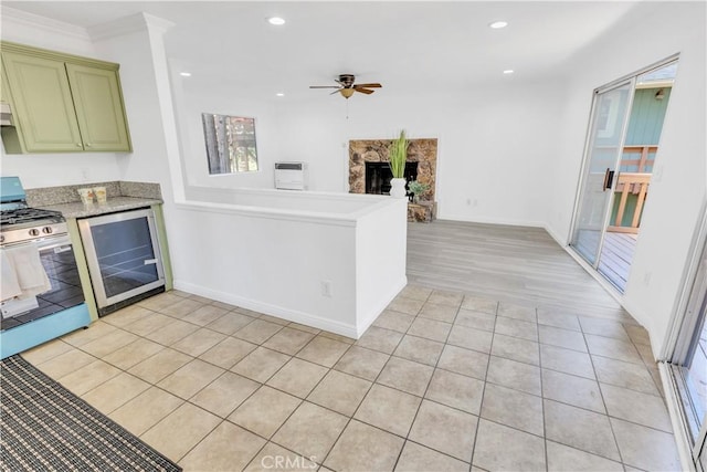 26188 Boulder Ln, Twin Peaks, CA 92391 - kitchen featuring stainless steel range with gas stovetop, beverage cooler, a ceiling fan, light tile patterned floors, and open floor plan