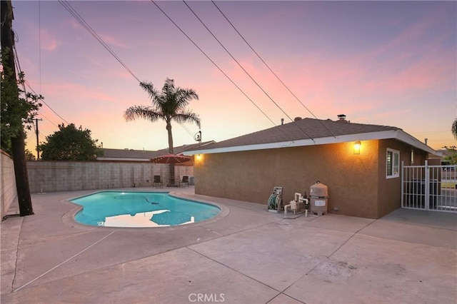 3126 E Merrygrove St, West Covina, CA 91792 - pool at dusk featuring a patio area and a fenced backyard